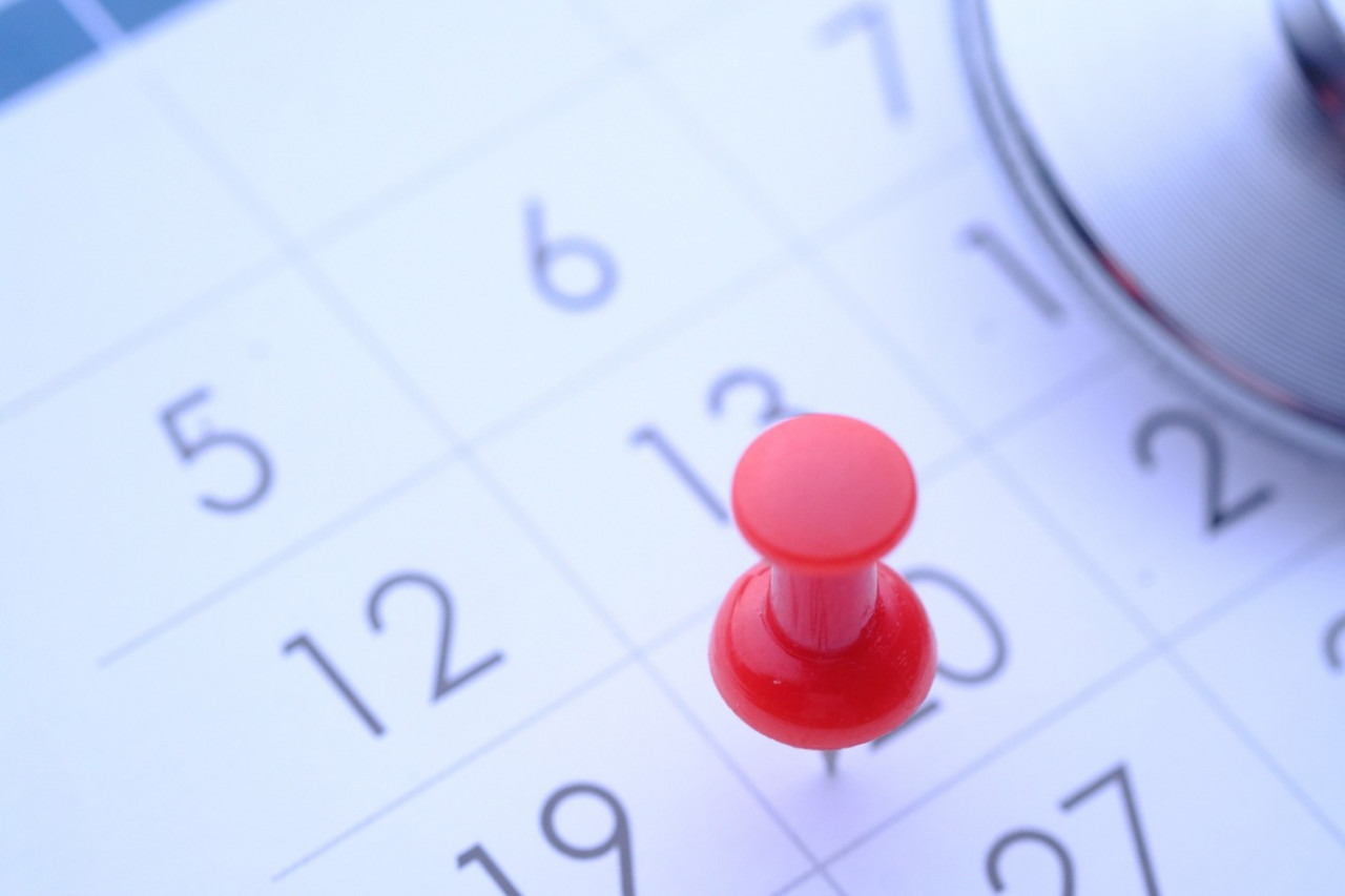 Calendar with red pushpin representing workplace training compliance deadlines