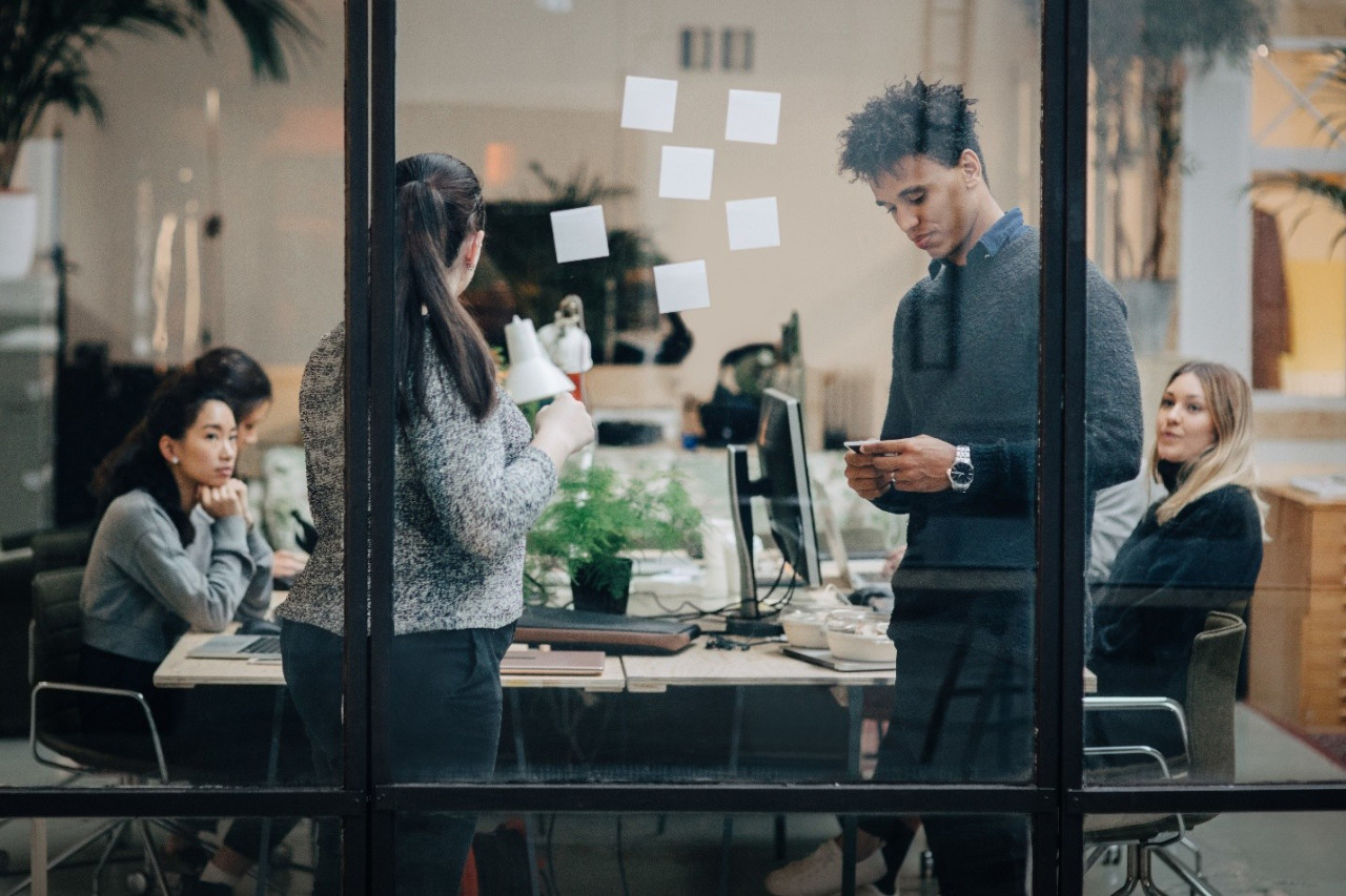 Employees in an office representing workforce engagement and employee turnover